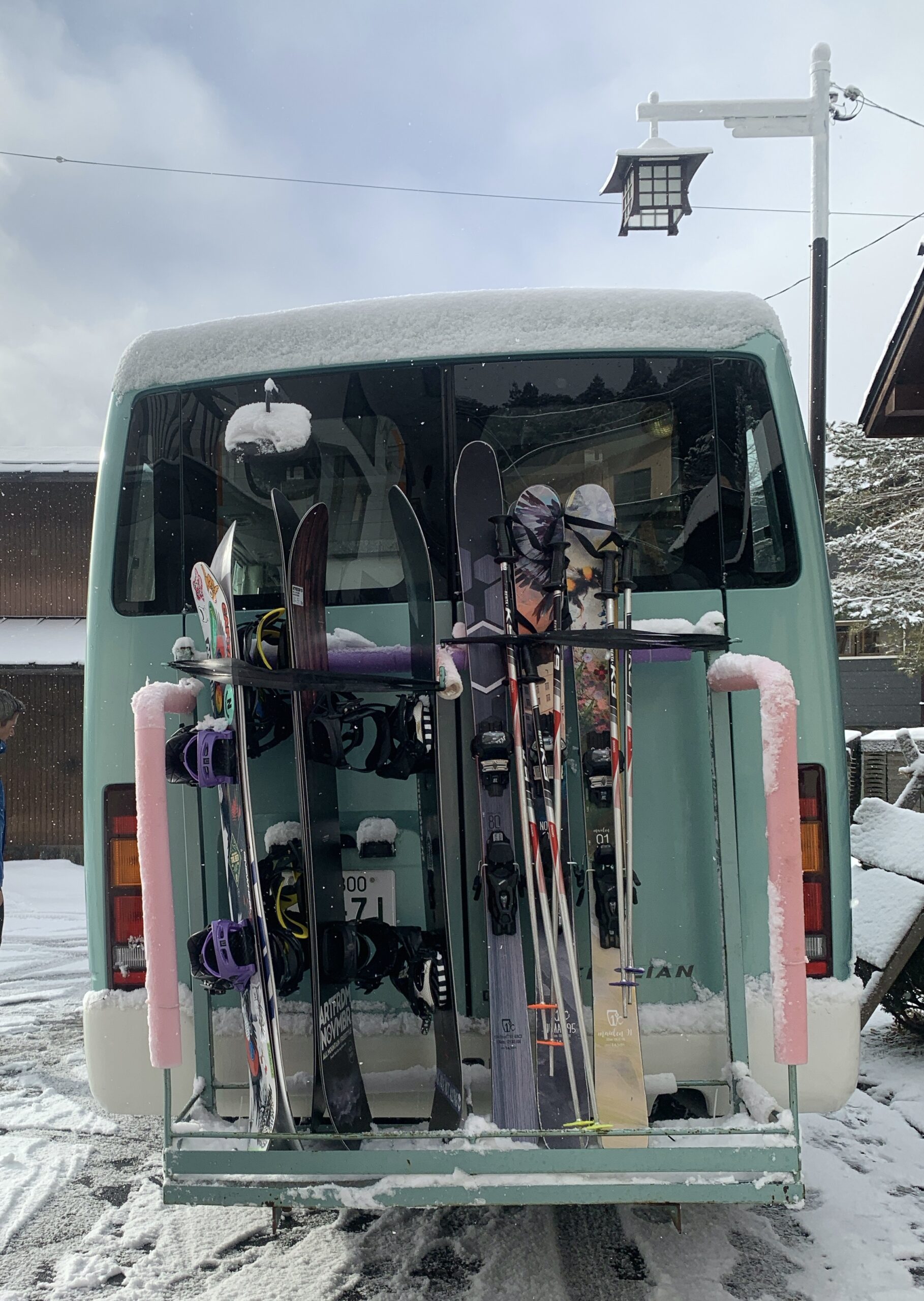 Skis and Snowboards on a bus
